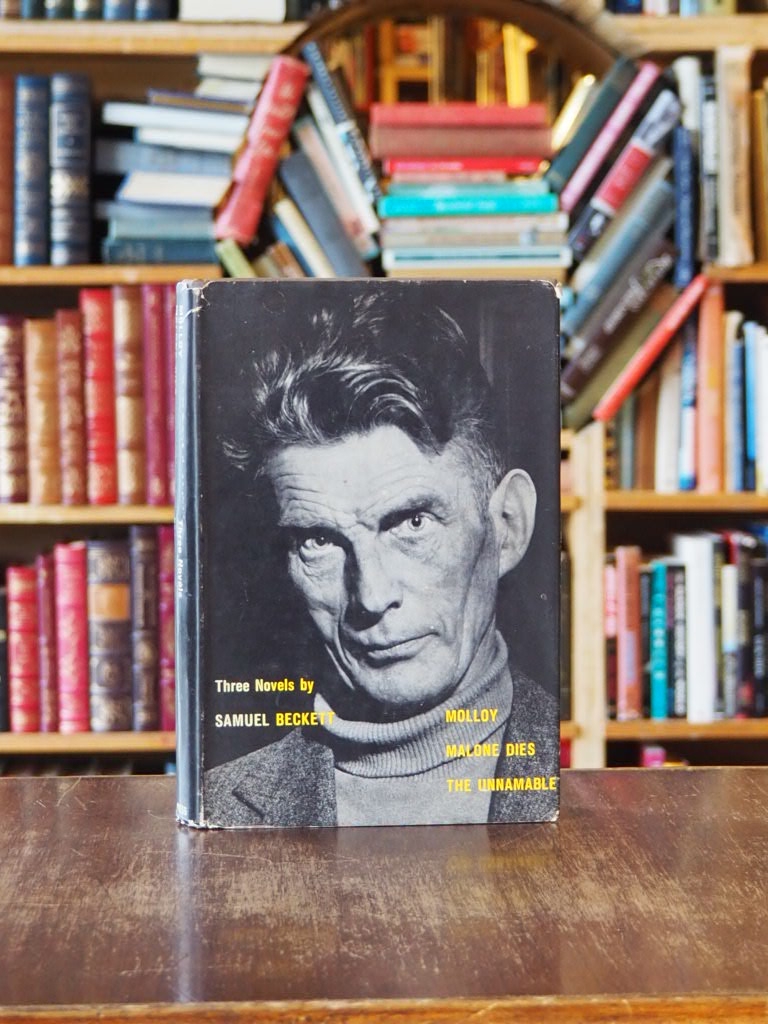 Three Novels by Samuel Beckett : Molloy, Malone Dies, The Unnamable. First Grove Press Edition in dustjacket.