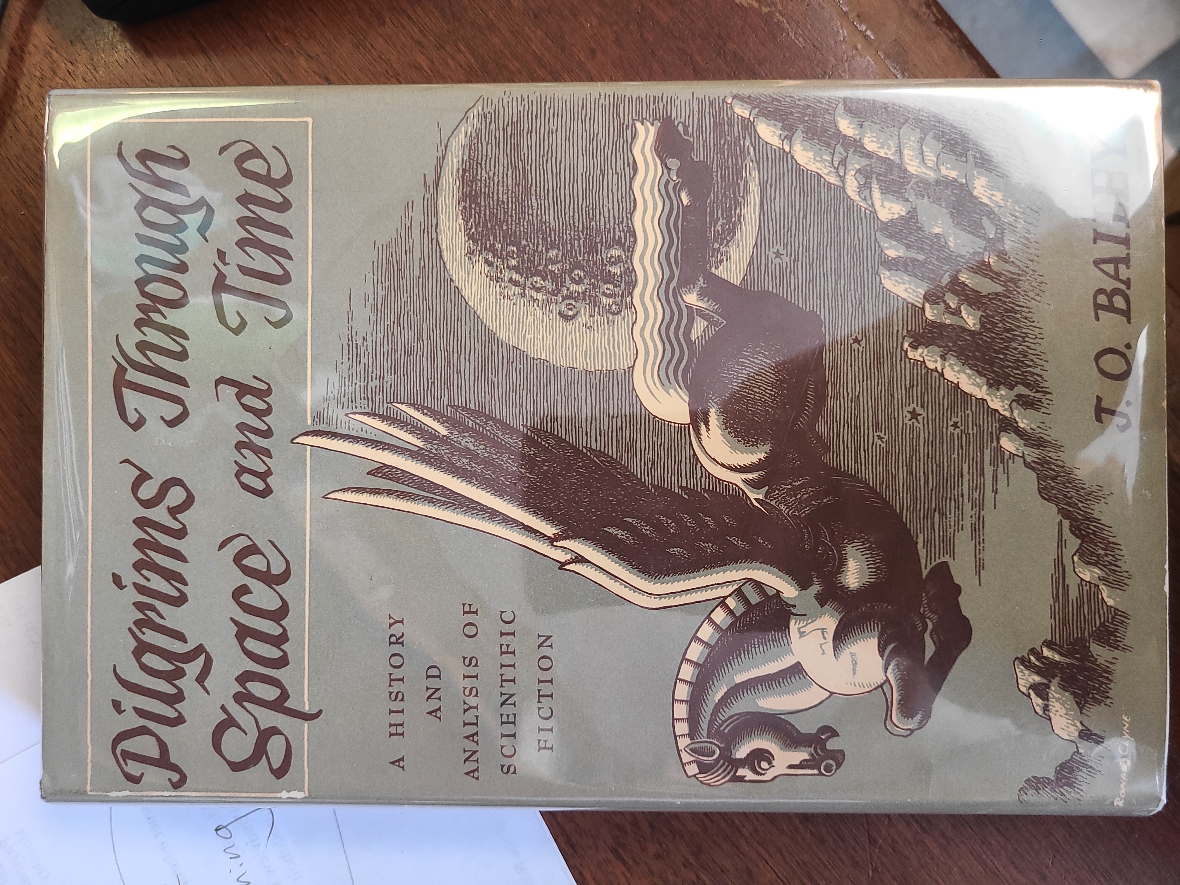 Pilgrims Through Space and Time. first edition, unclipped dustjacket.