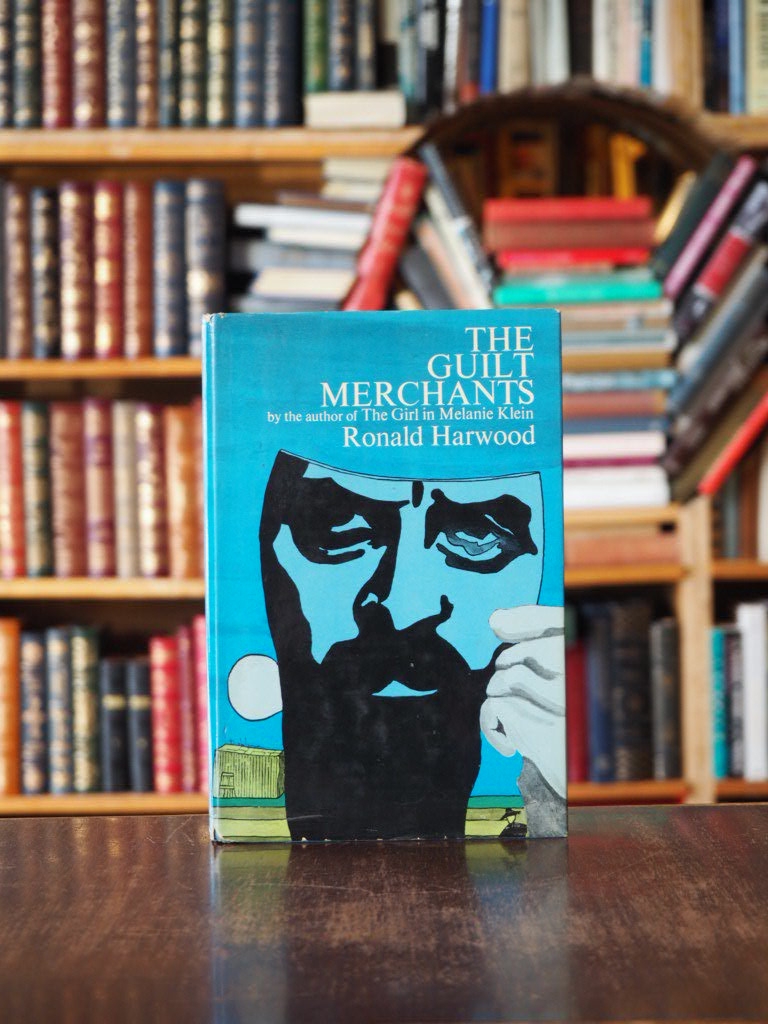 Guilt Merchants. First American Edition in dustjacket
