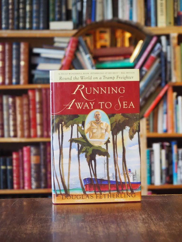 Running Away to Sea : Round the World on a Tramp Freighter. First Edition in dust jacket