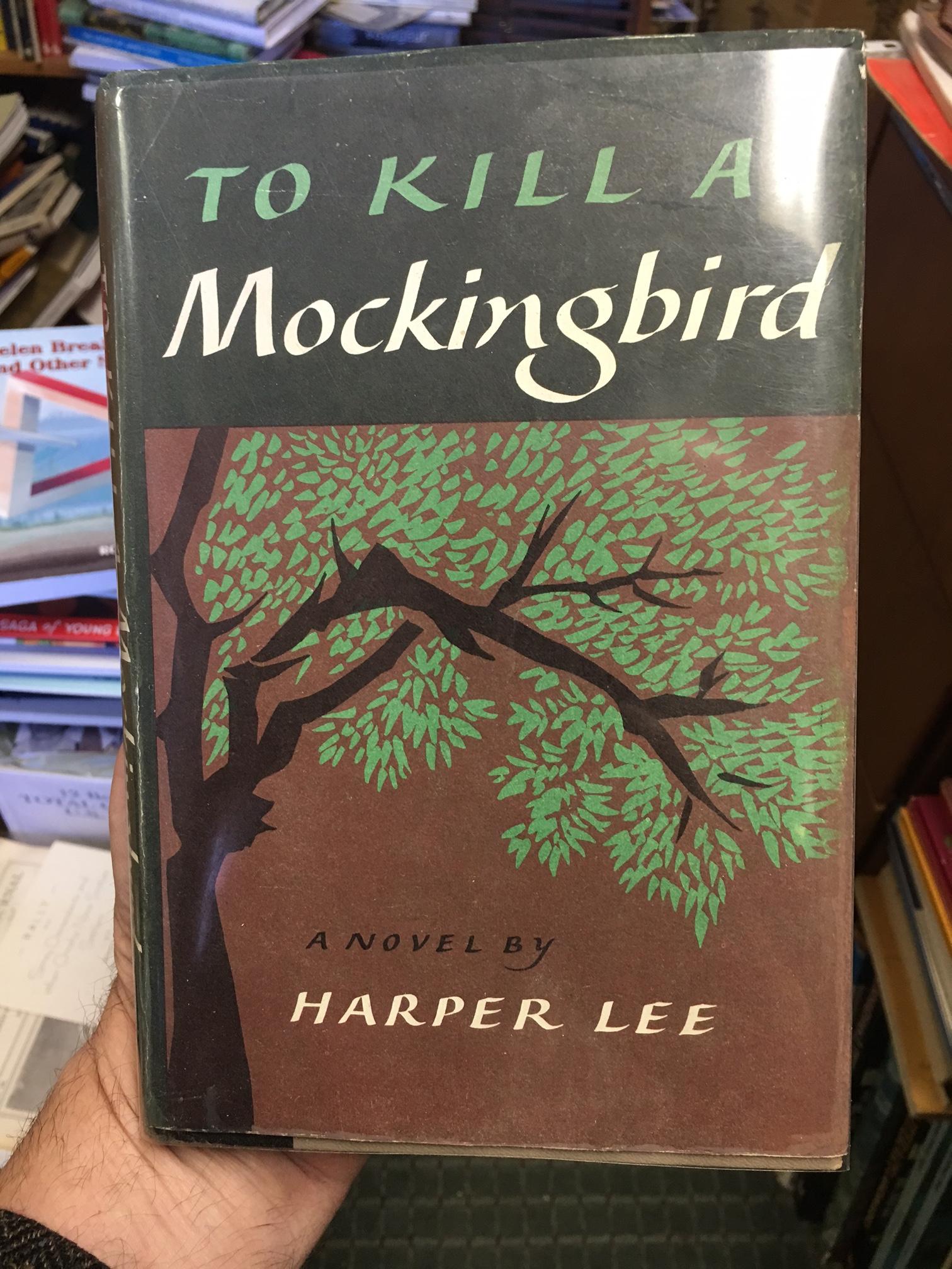 To Kill a Mockingbird. Book Club Edition in dust jacket. With a collector's card signed by Harper Lee laid in.
